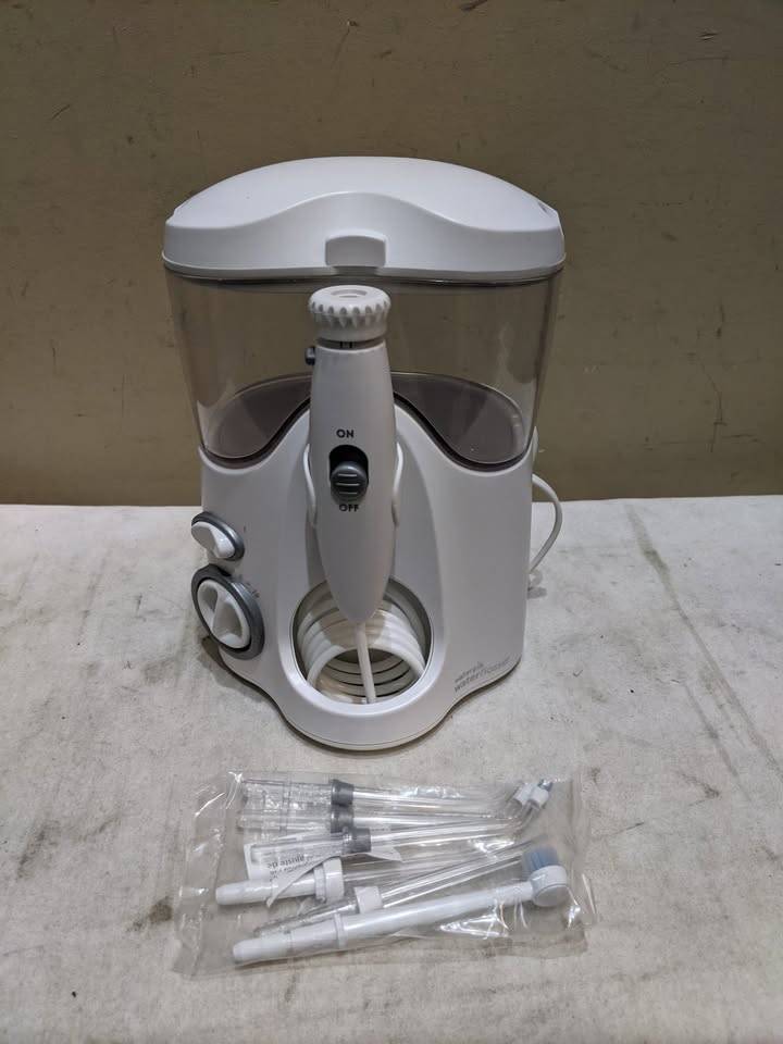 Waterpik Water Flosser Ultra WP-140C, with brand new tips