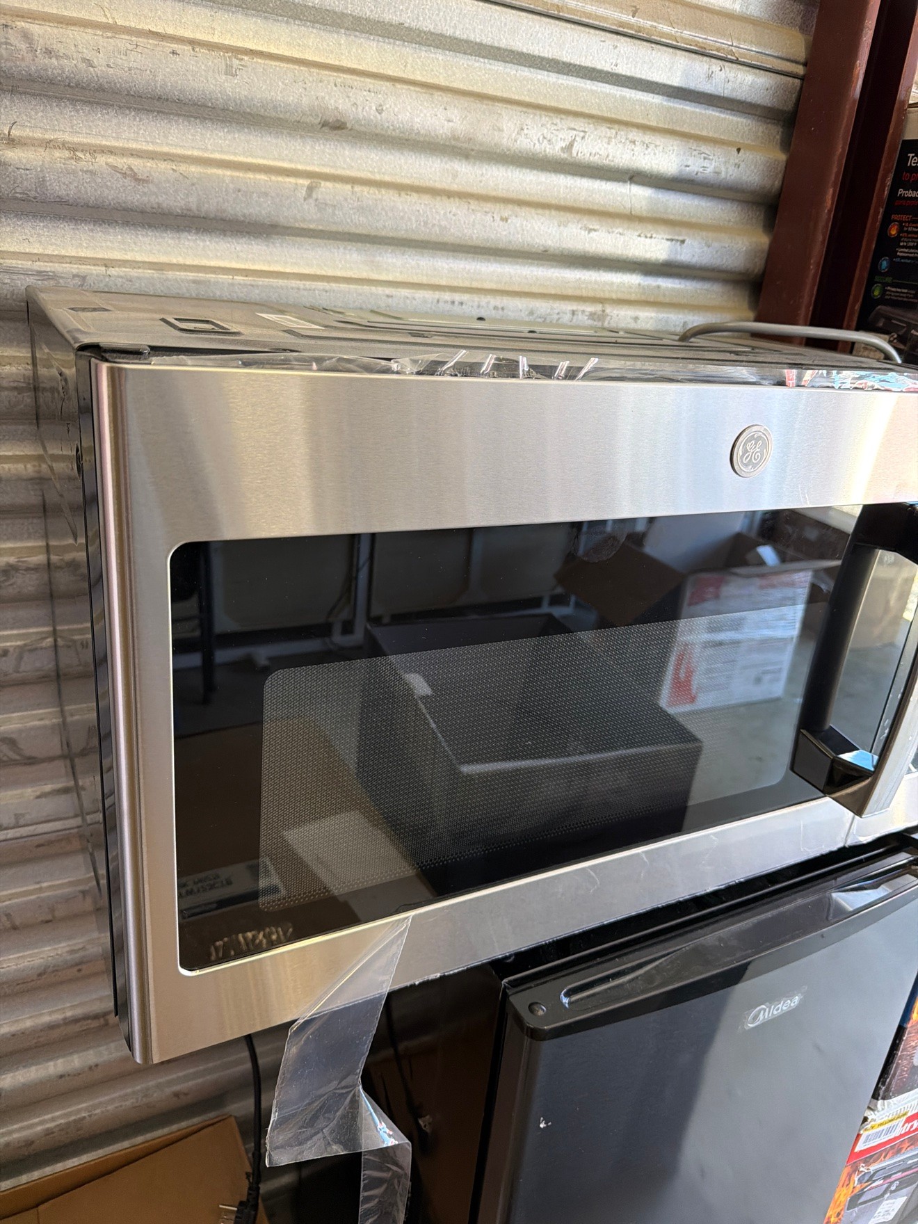 GE JVM3160RF9SS 1.6 cu ft Over-Range Microwave SS — New - photo 2