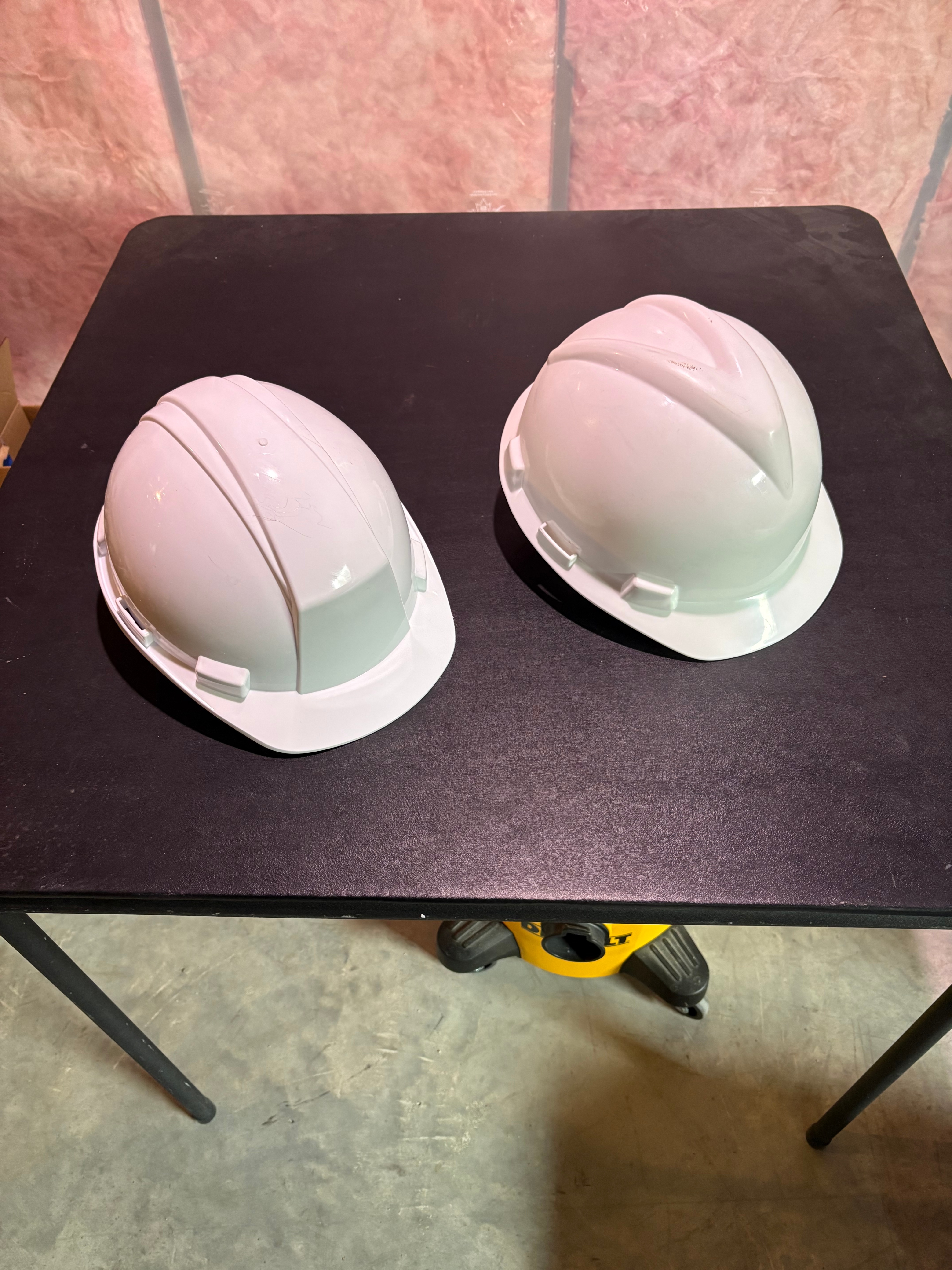 Two White Construction Hard Hats