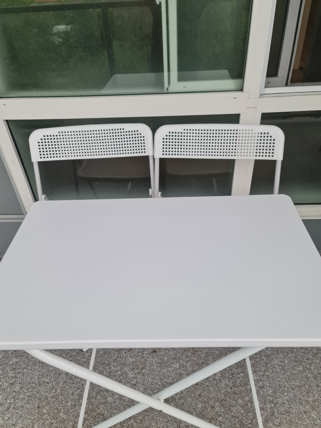 White outdoor table and Chairs from IKEA.