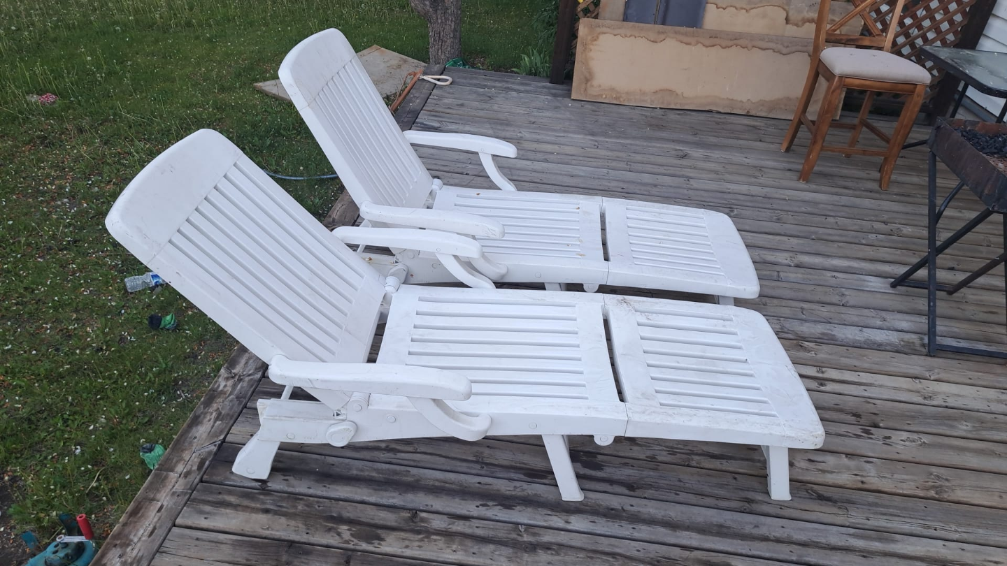 Pair of White Plastic Lounge Chairs