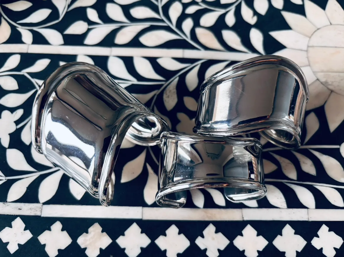 Set of 3 silver toned metal bracelets image indicator(2)