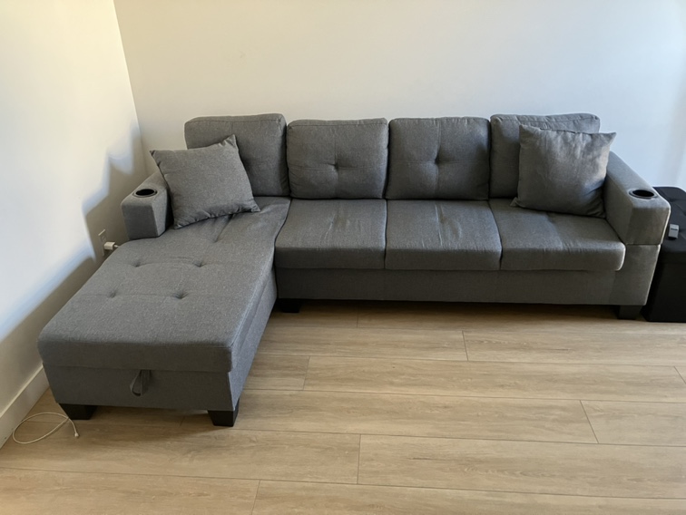 Grey sectional with storage chaise with cupholders