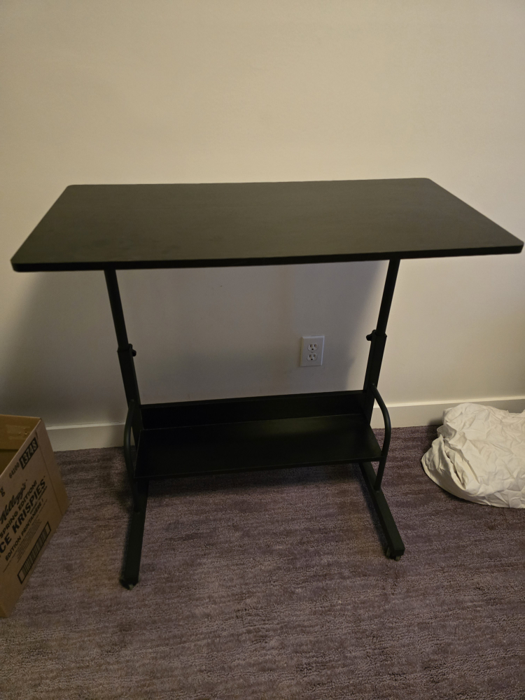 Black adjustable height desk