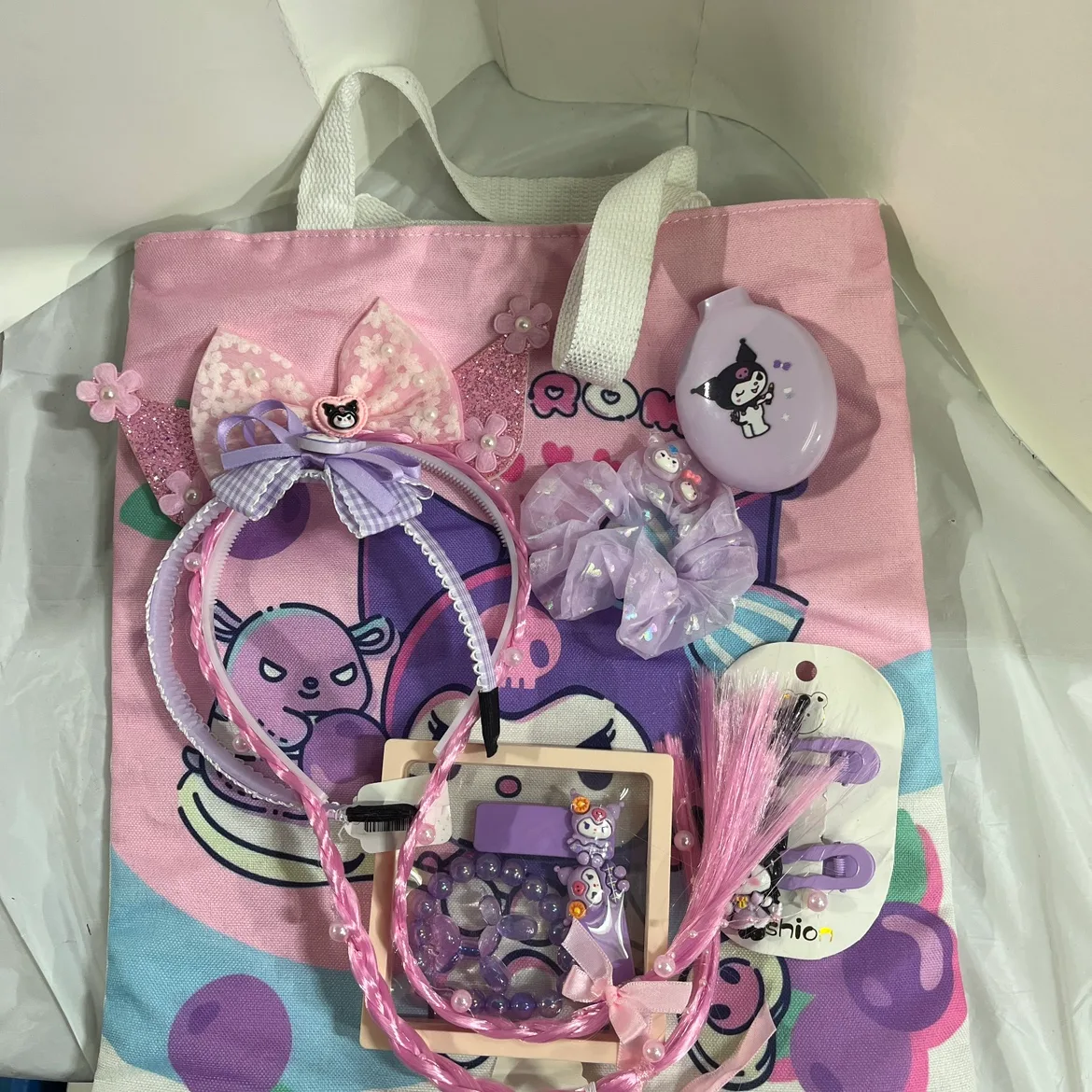 Kuromi tote bag filled with hair accessories, and bracelets image indicator(8)
