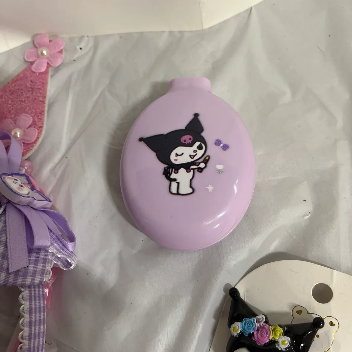 Kuromi tote bag filled with hair accessories, and bracelets image indicator(5)