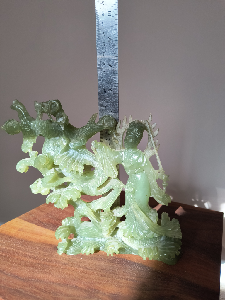 vintage Jade sculpture art, a woman fighting with a man