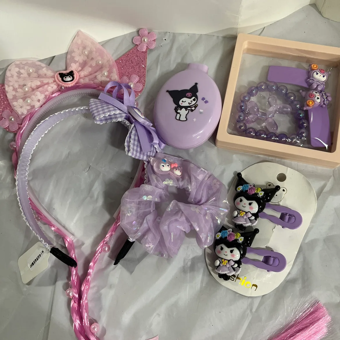 Kuromi tote bag filled with hair accessories, and bracelets image indicator(6)