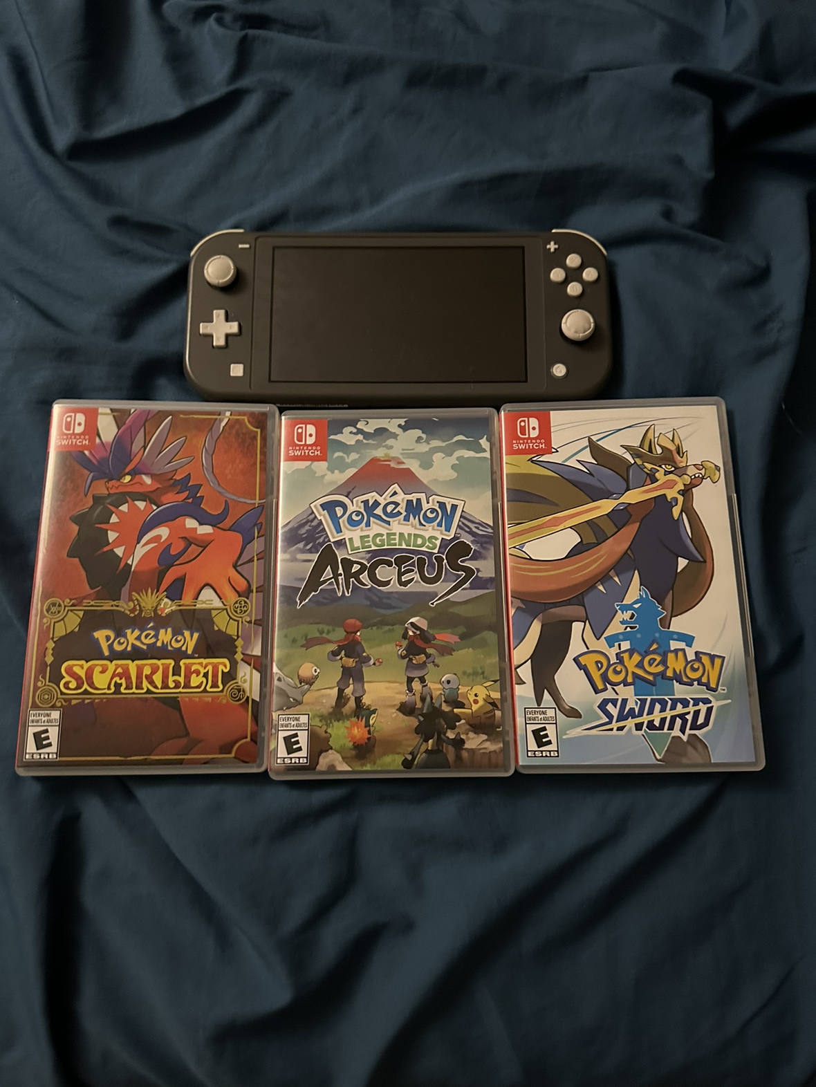 Nintendo Switch Lite + Pokémon Game Titles