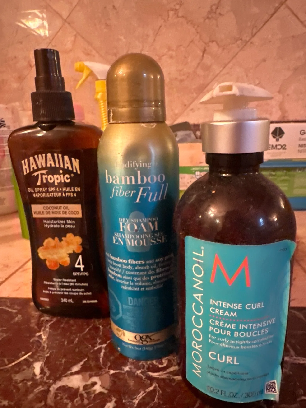 Two  Bottles of Hair Products & tanning oil thumbnail