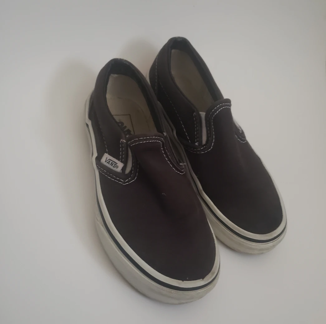Black and white Vans Slip-On Shoes