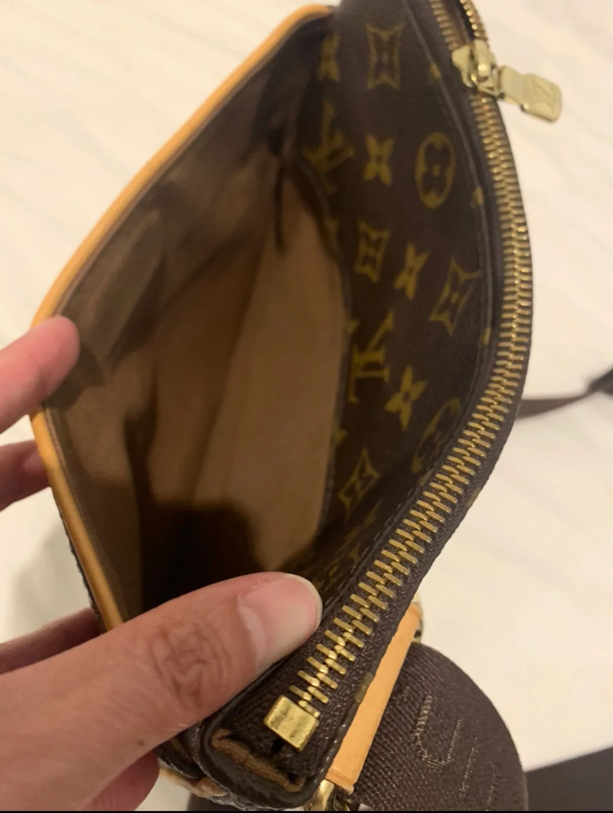 Authentic Louis Vuitton Pochette Valmy Crossbody Bag image indicator(7)