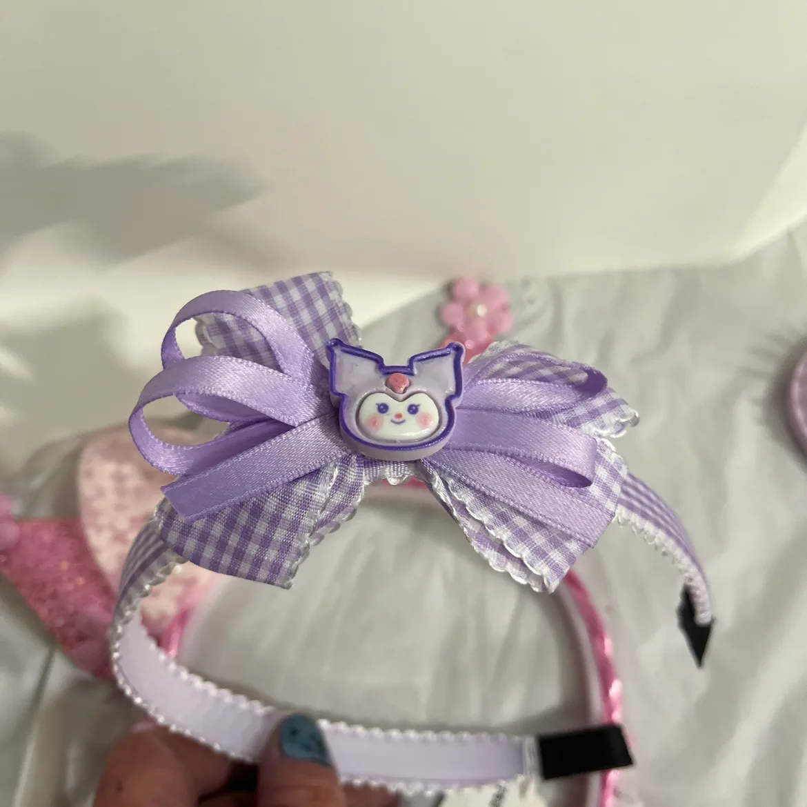 Kuromi tote bag filled with hair accessories, and bracelets image indicator(4)