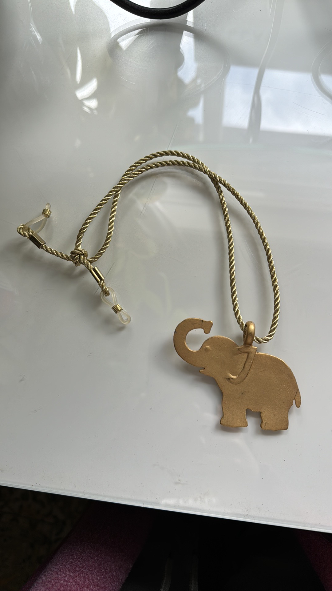 Gold elephant pendant on gold rope fabric chain necklace