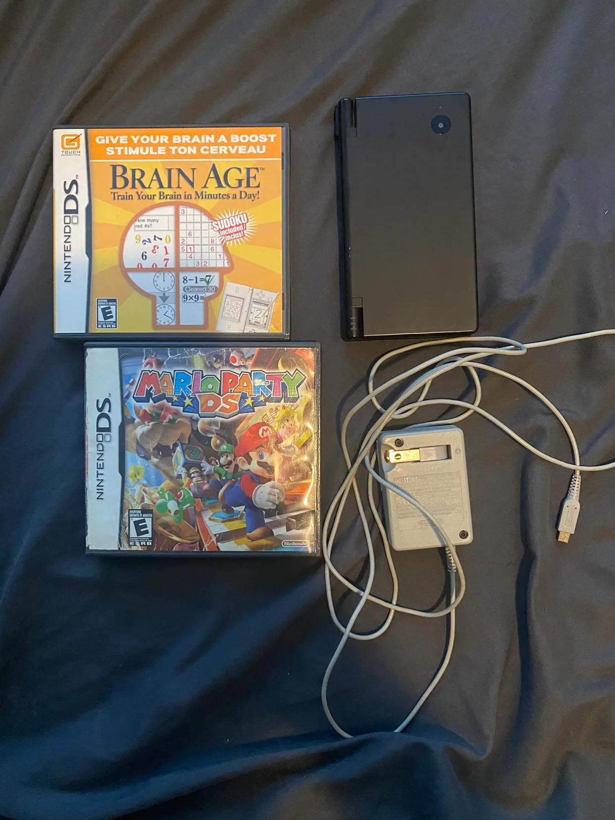 Nintendo DSi Complete with charger, stylus, and games! thumbnail