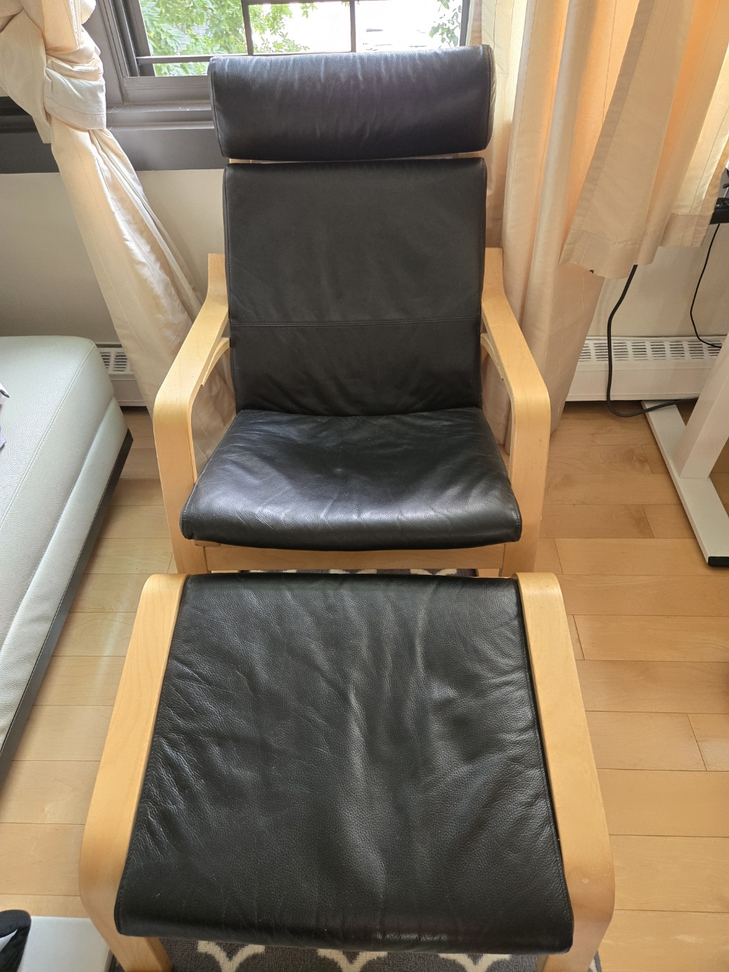 IKEA rocking chair with a foot rest