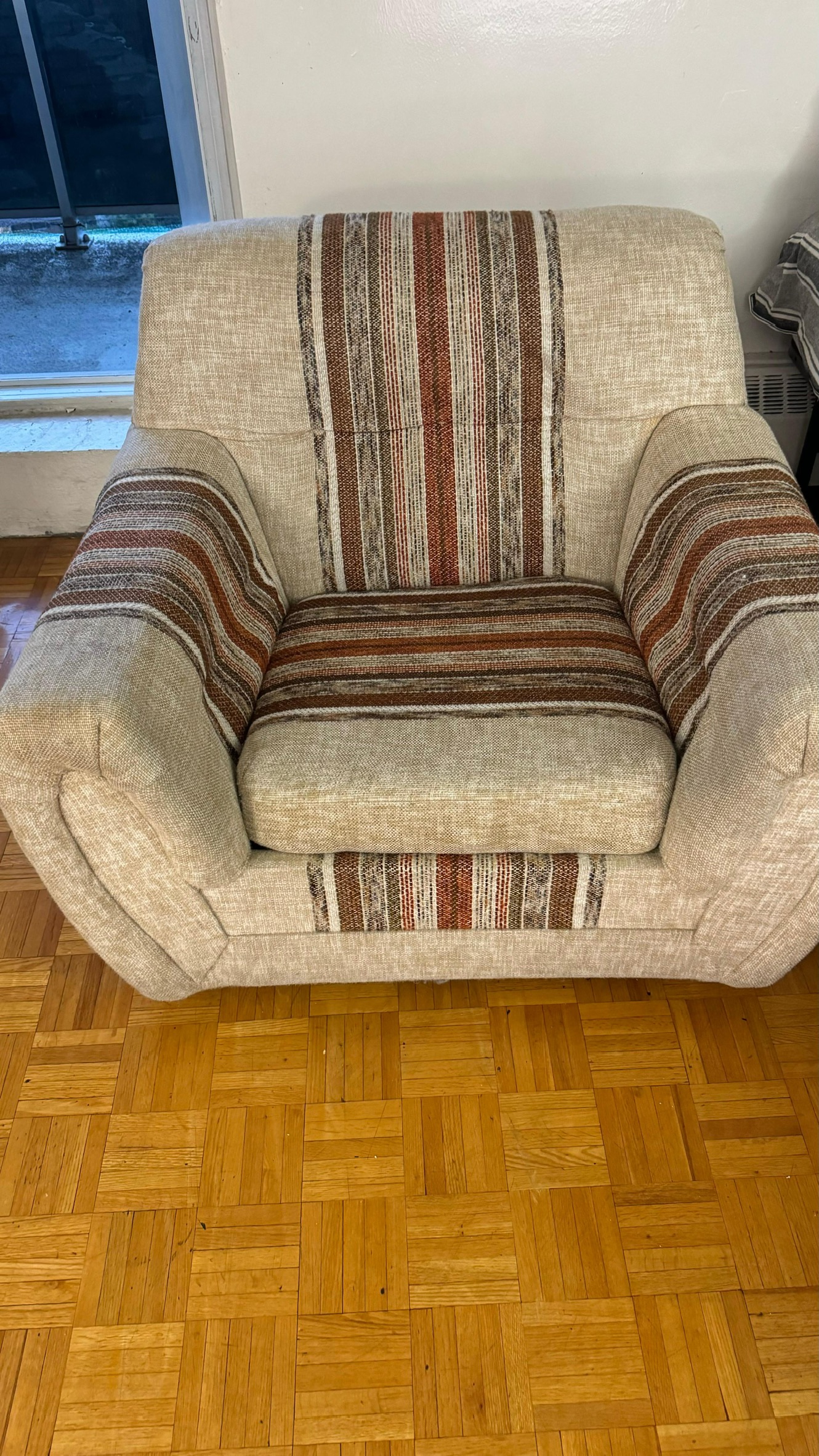 Armchair with striped upholstery