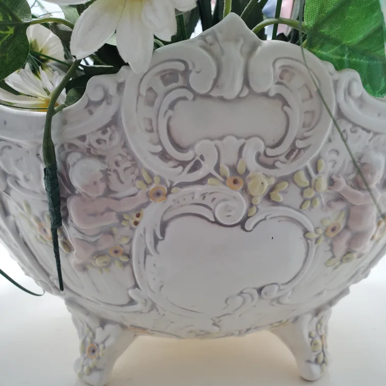 Artificial flowers in vintage planter image indicator(2)