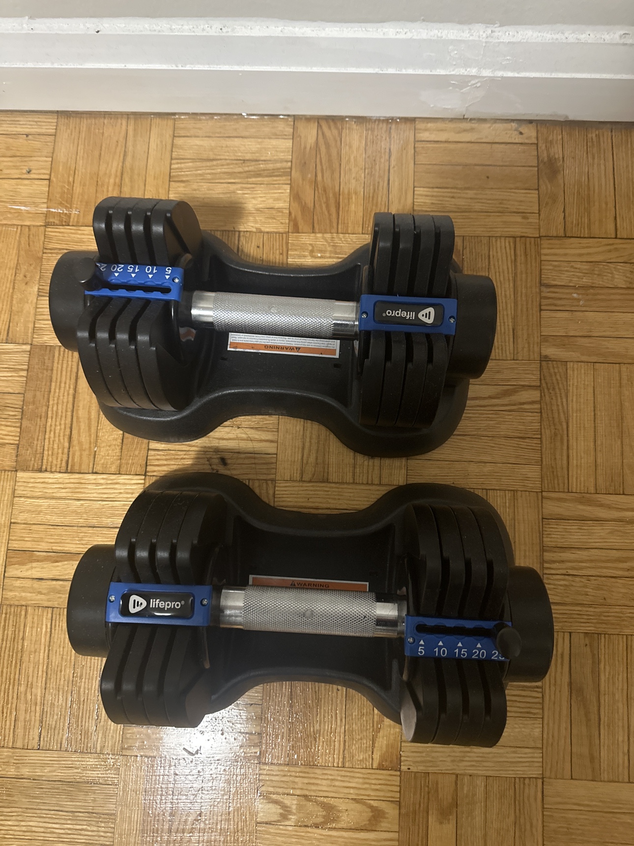 Lifepro Adjustable dumbbells 5-25 lb sold as a set and