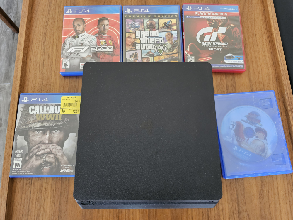 Playstation 4 Bundle with Almost New Remote & 5 Game Titles