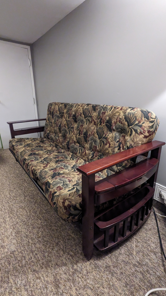 Futon with double size Sealy spring mattress