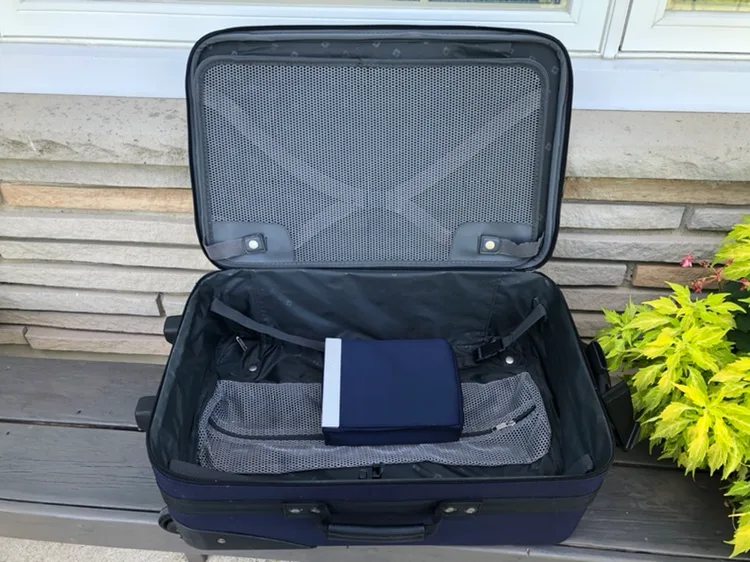 Carry-on Suitcase plus small blue tote bag image indicator(3)