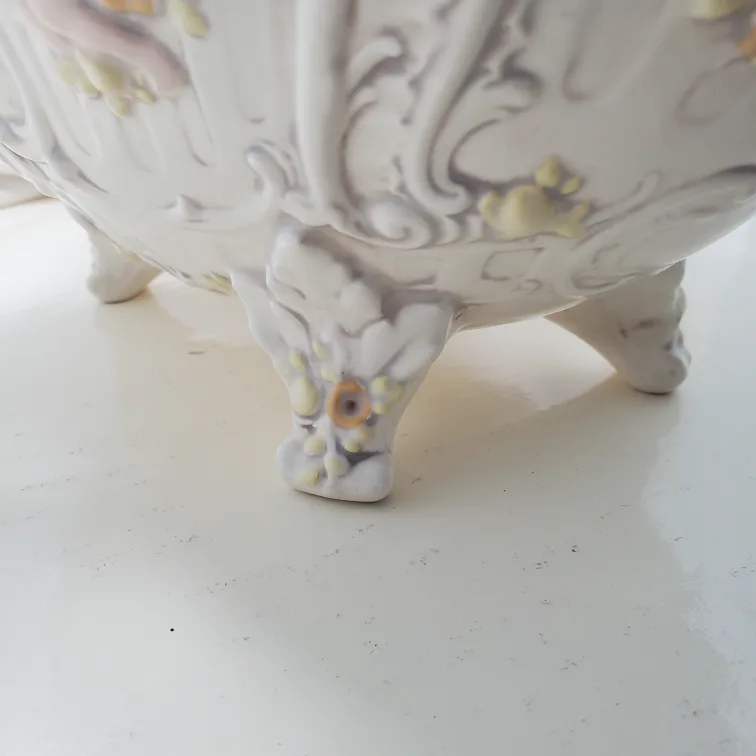 Artificial flowers in vintage planter image indicator(8)