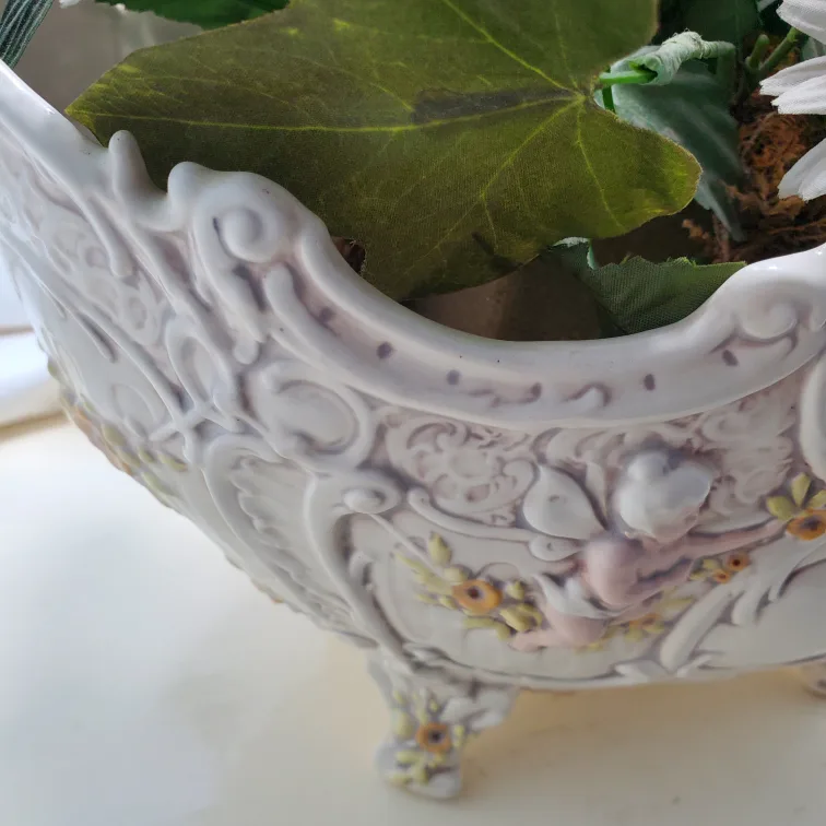 Artificial flowers in vintage planter image indicator(9)