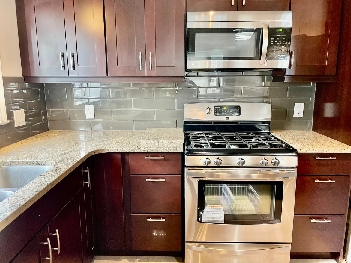 Genuine Wood Kitchen Cabinets and appliances thumbnail