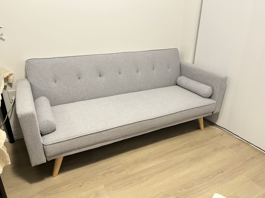 Light grey upholstered sofa bed
