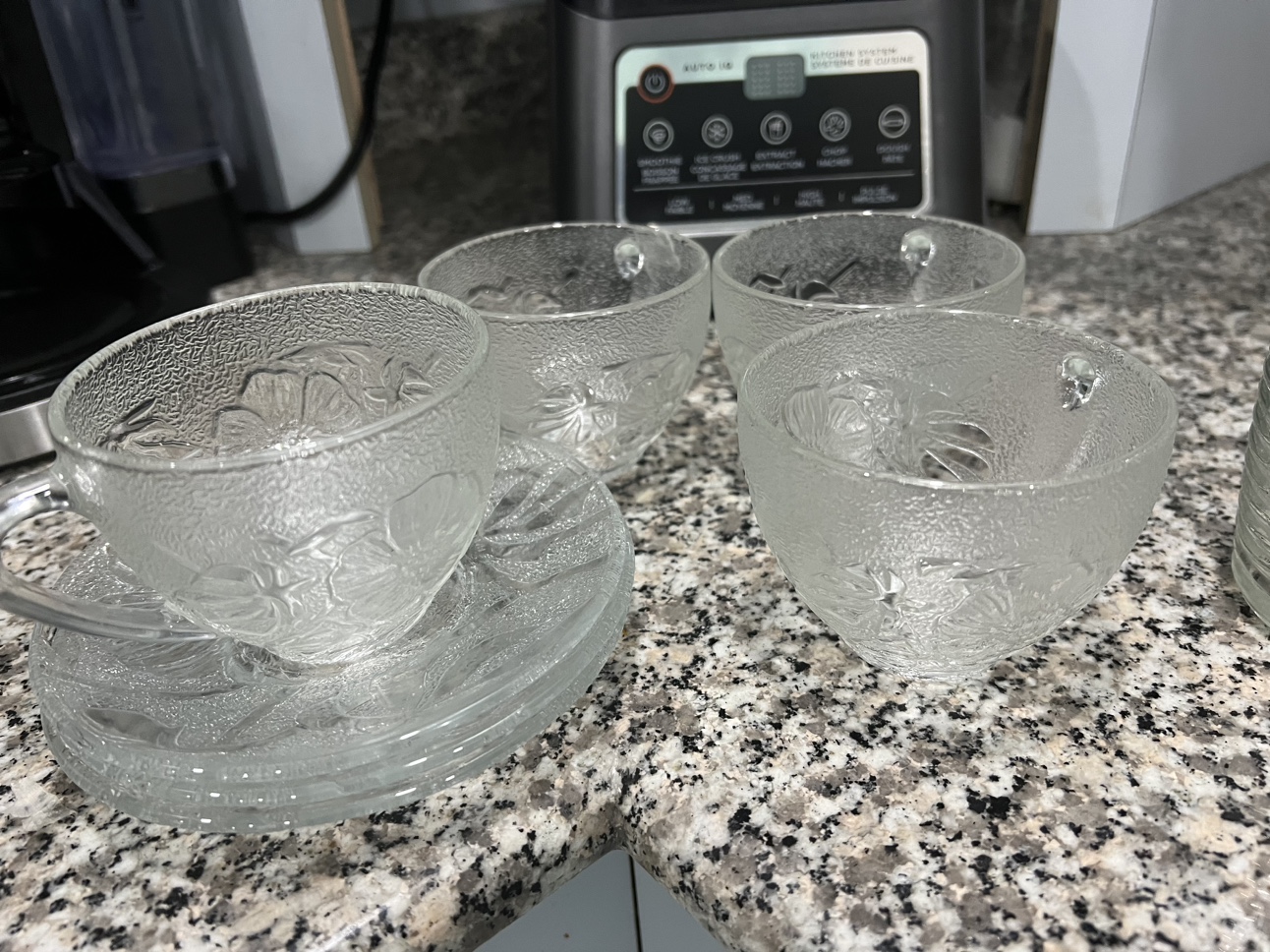 Set of Four Glass Cups and Saucers