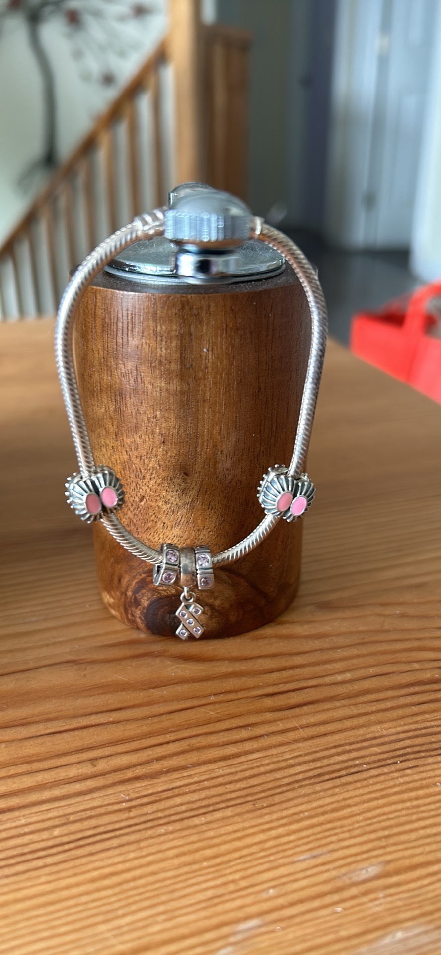 Pandora bracelet with breast cancer ribbon charm
