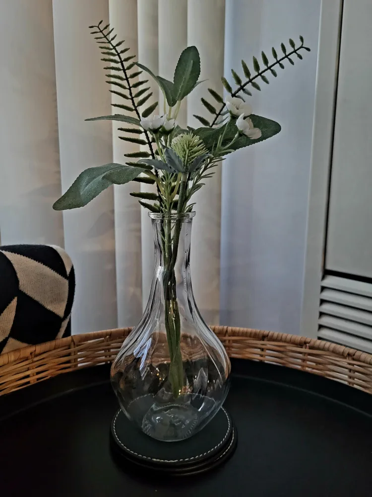 A small glass vase with artificial flower thumbnail