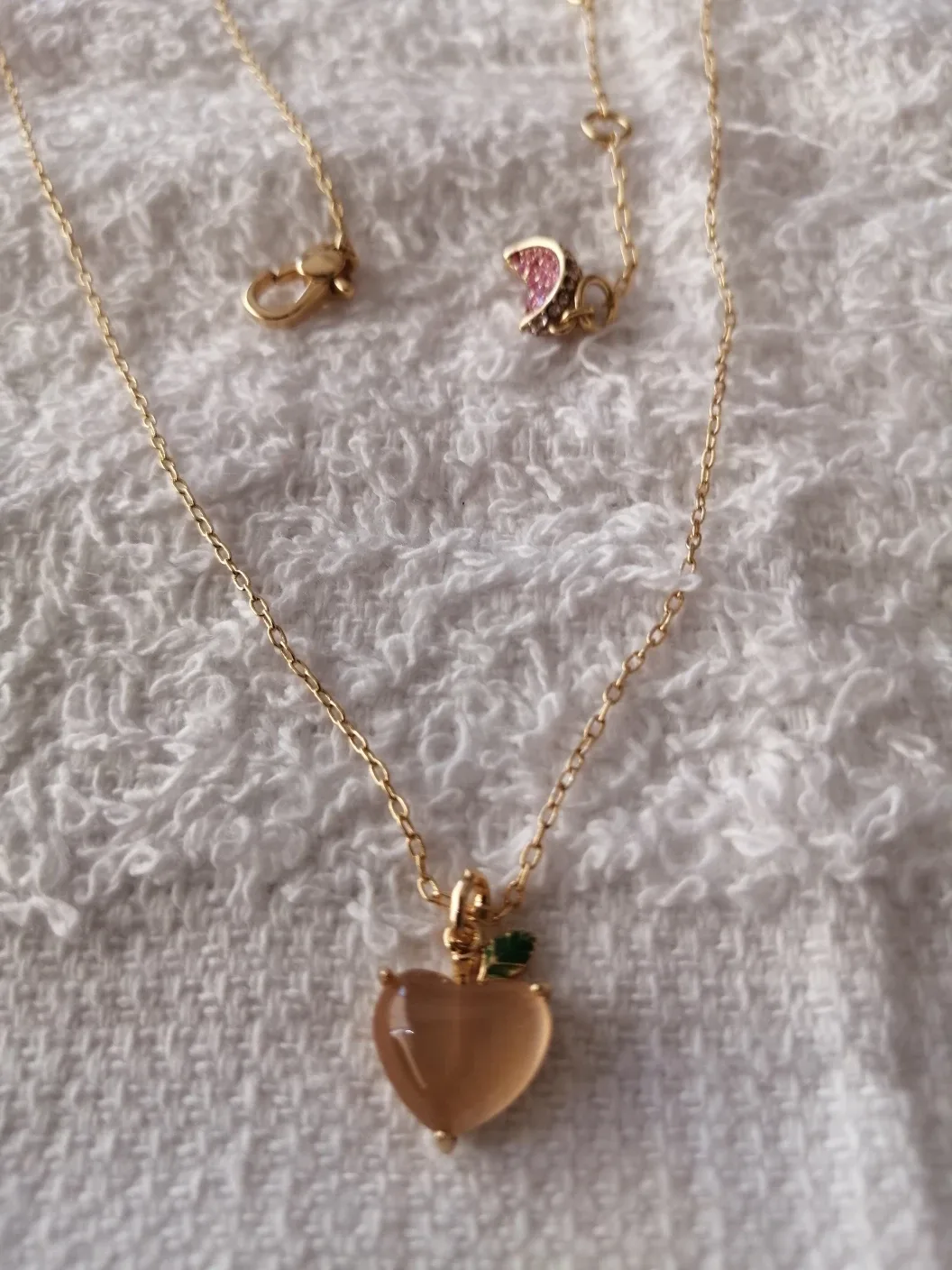 Kate Spade Peach Charm necklace thumbnail
