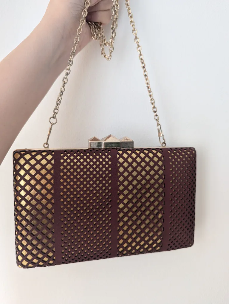 Gold and burgundy evening clutch with chain image indicator(4)
