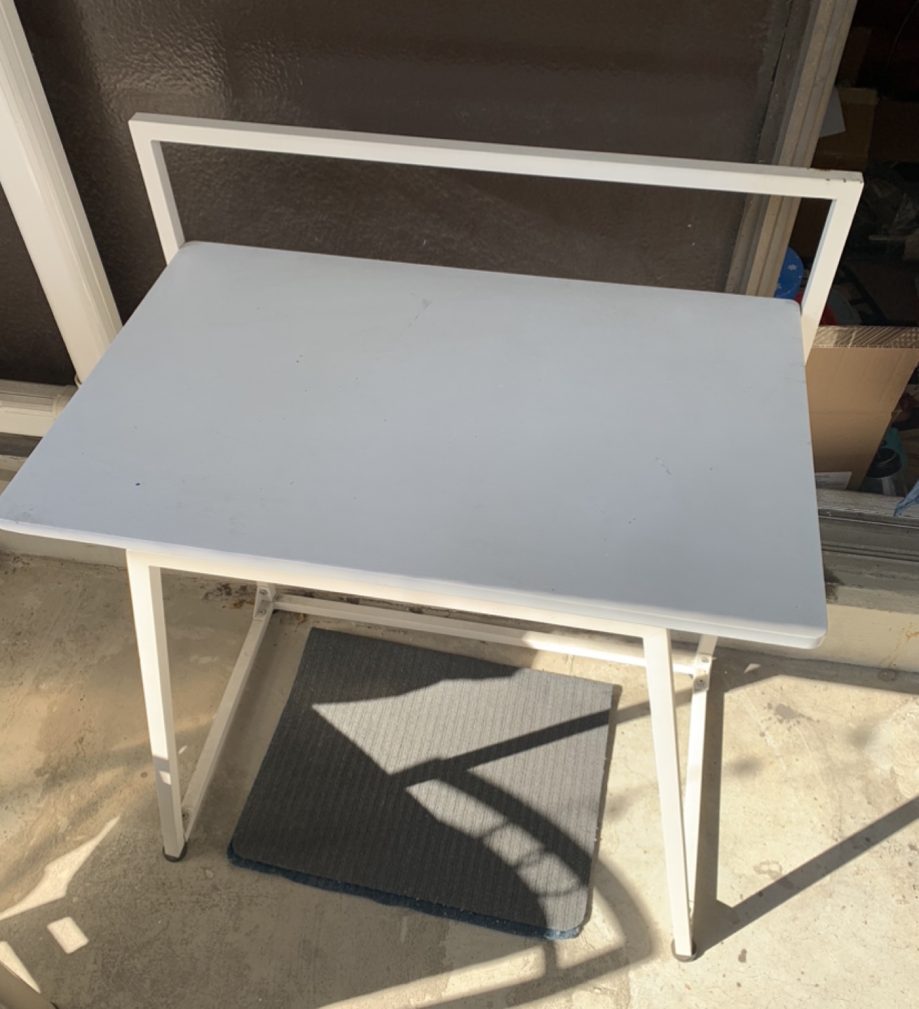 Black Folding Chair and White Metal Small Desk