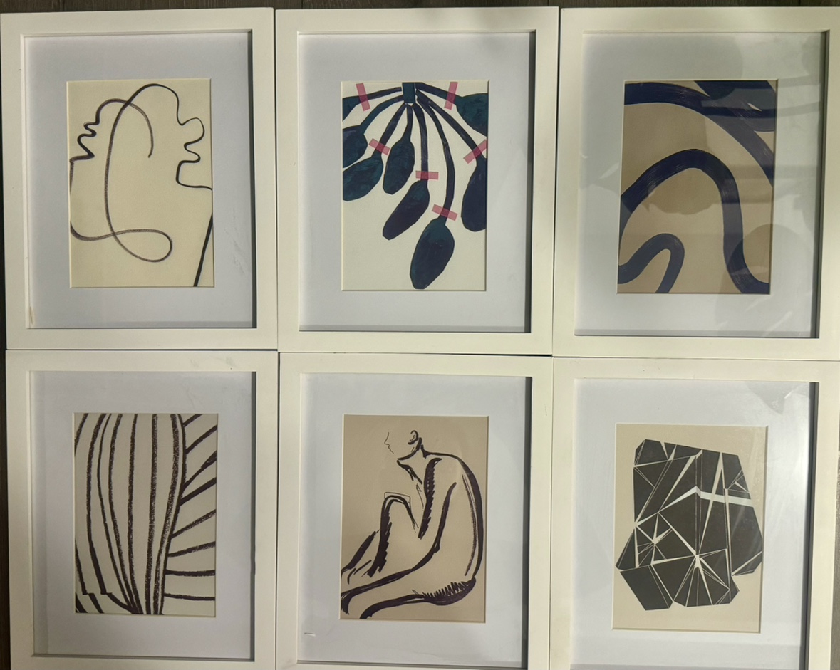 6 white framed art pieces
