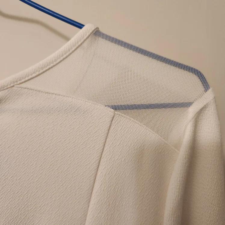 White long sleeve top with mesh detail image indicator(5)