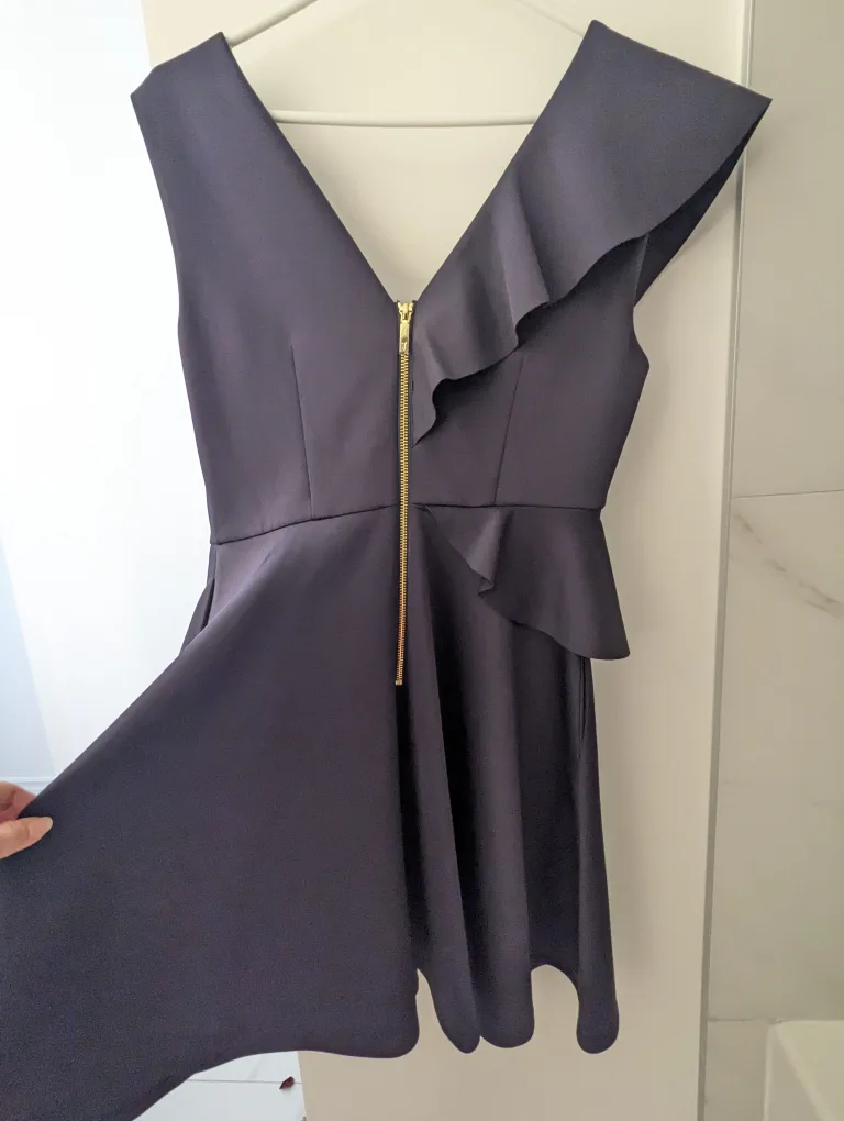 Navy blue sleeveless dress with ruffle image indicator(4)