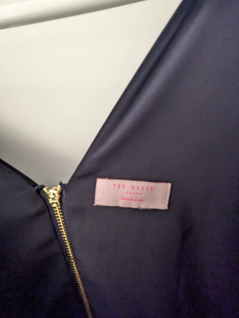 Navy blue sleeveless dress with ruffle image indicator(7)