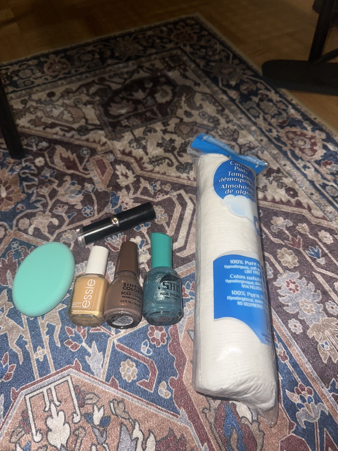 Beauty blender, one lipstick nude Nail polish and makeup remover