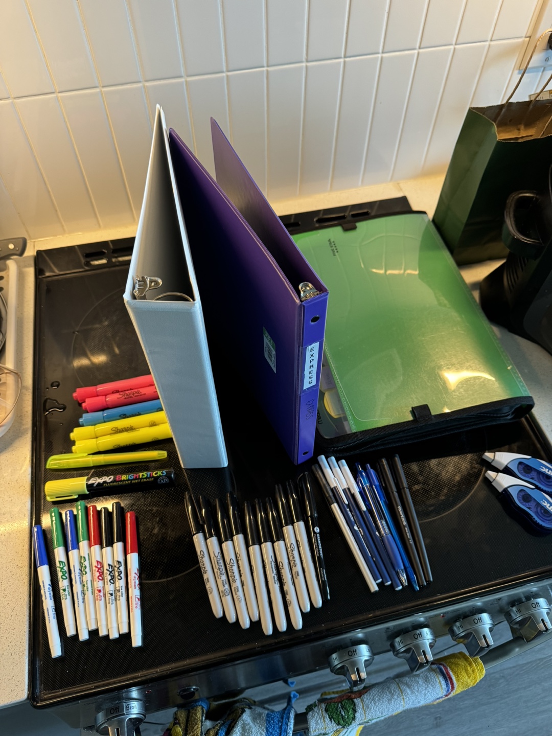 Binders and assorted pens and markers