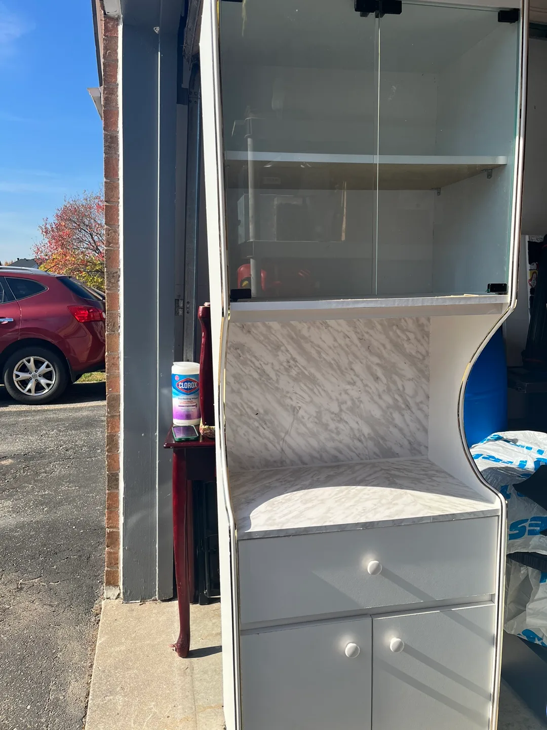 White cabinet with glass doors and marble-look top image indicator(3)