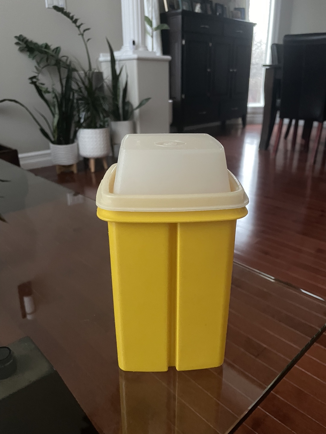 Yellow Tupperware pickle container