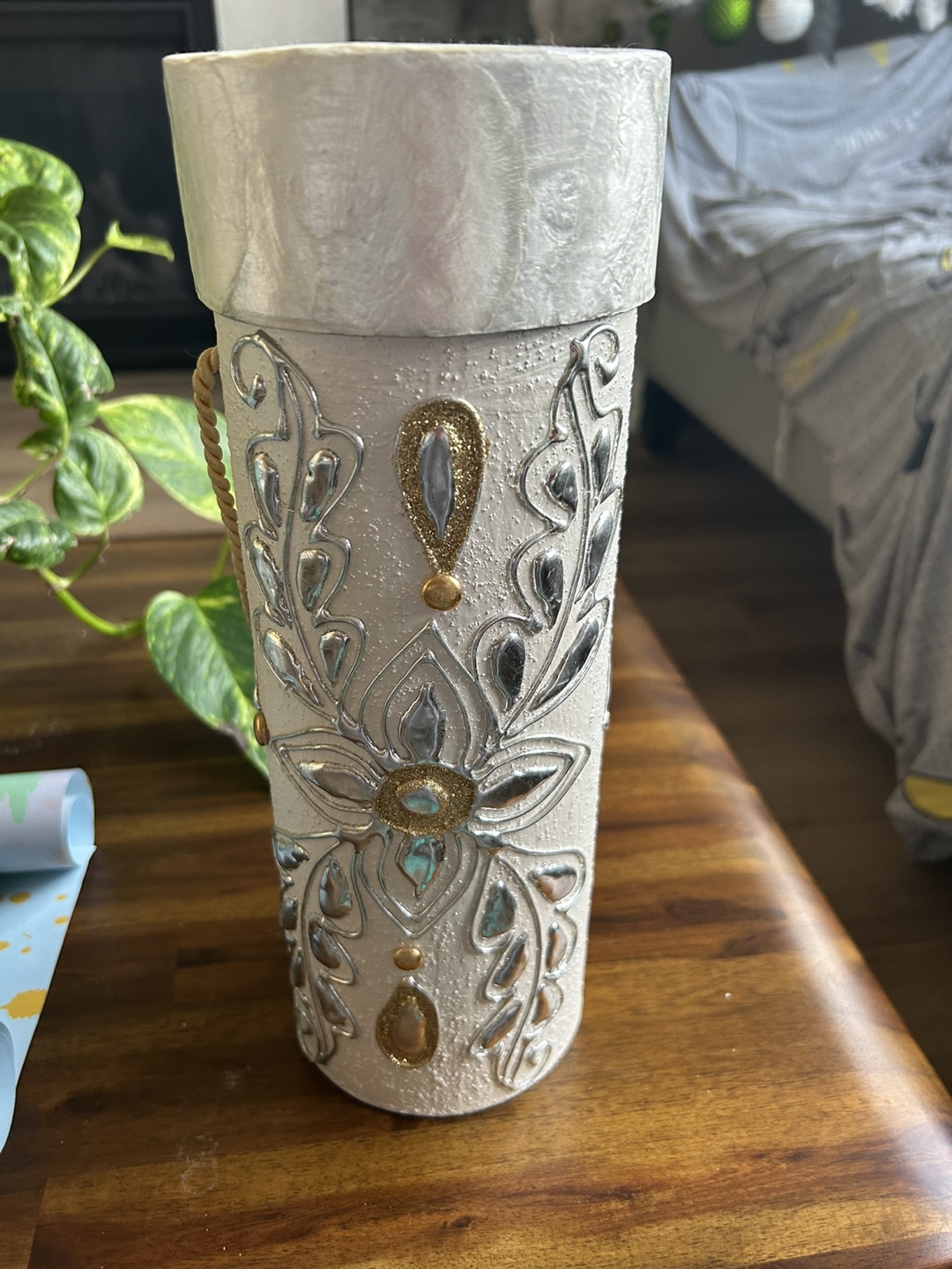 White decorative vase with silver and gold embellishments