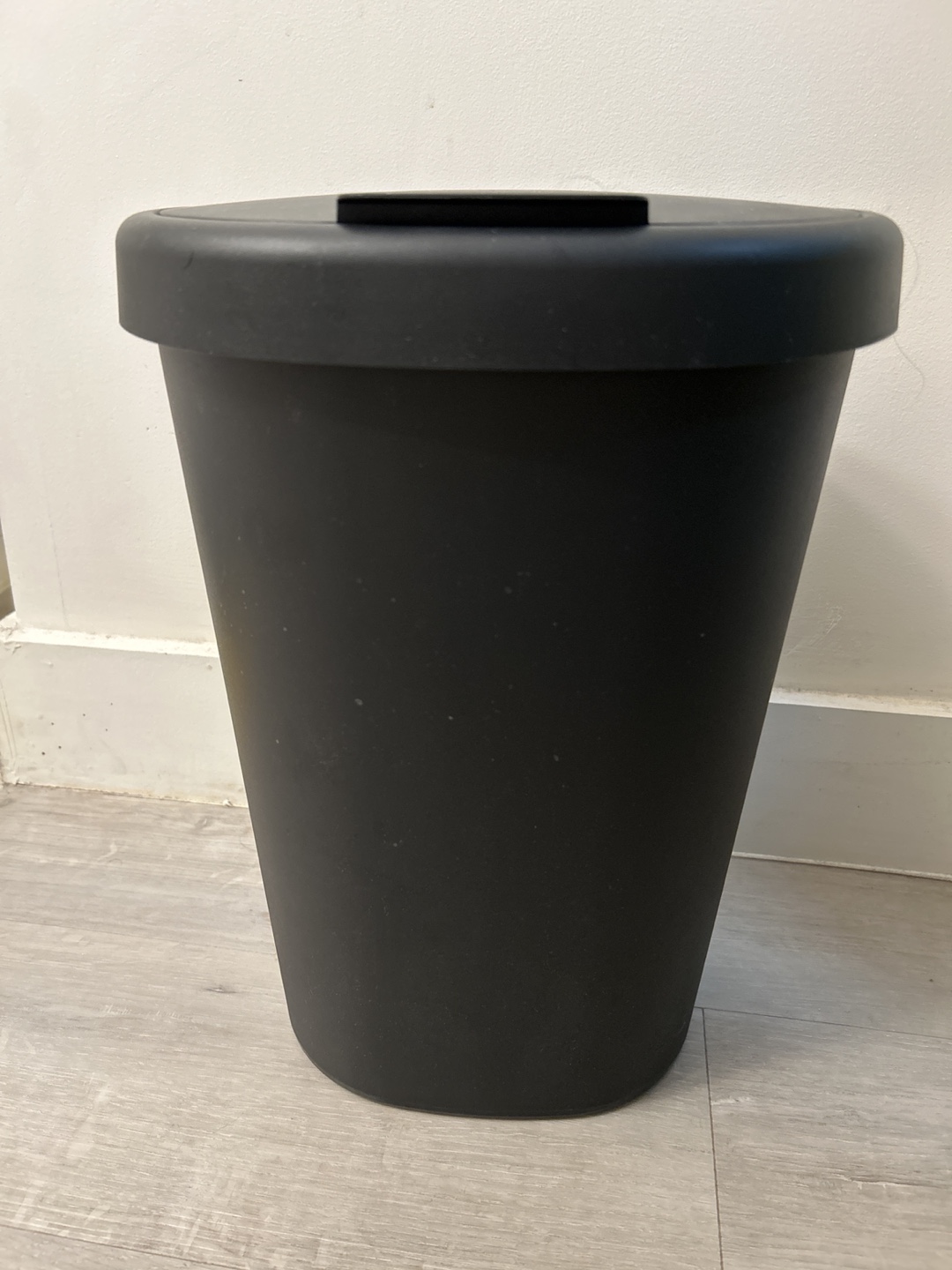 Black garbage can with lid