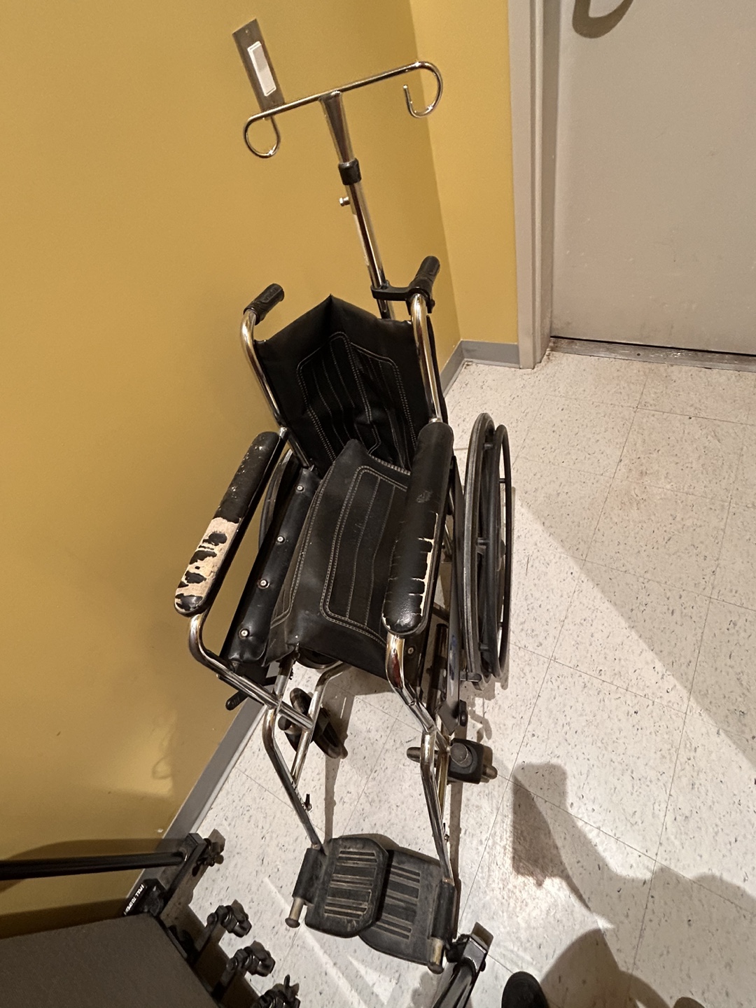 Wheelchair with IV pole
