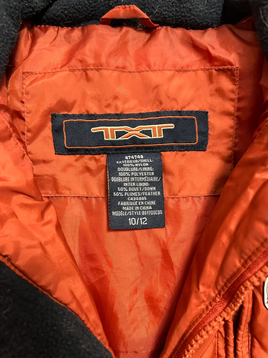 TXT Orange Puffer Vest image indicator(2)