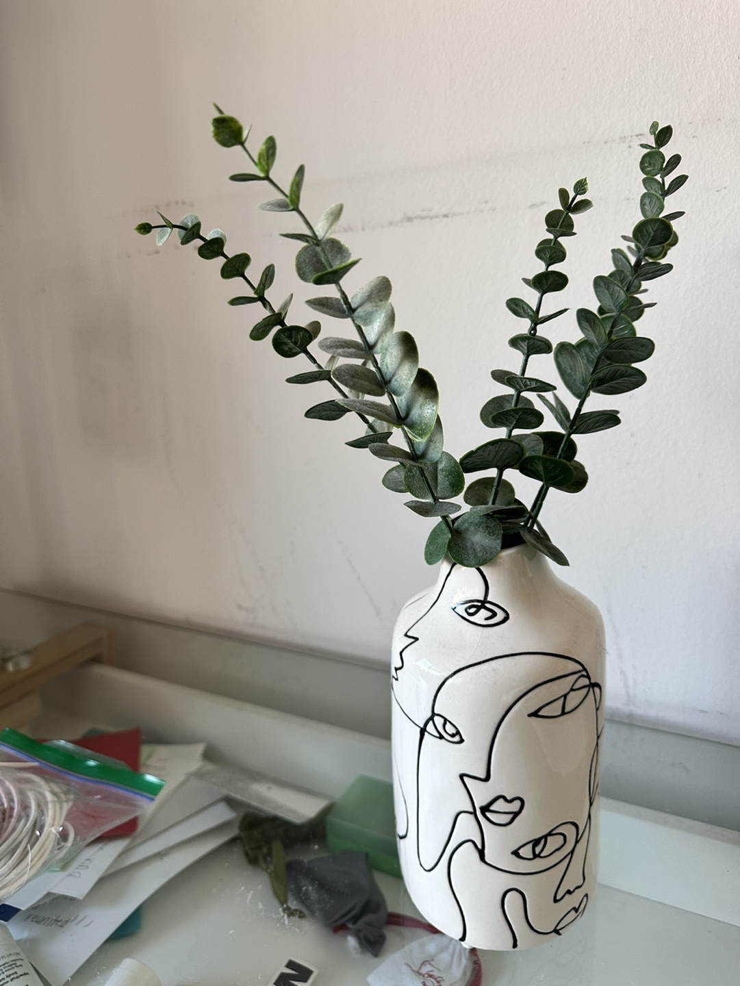 White Ceramic Vase with Line Art and Fake Eucalyptus