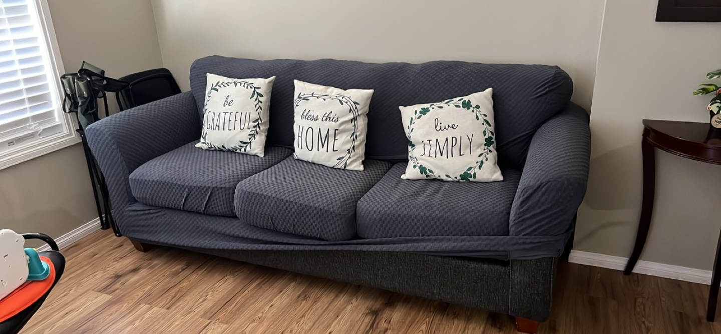 Three seated Grey Sofa with cover- moving sell